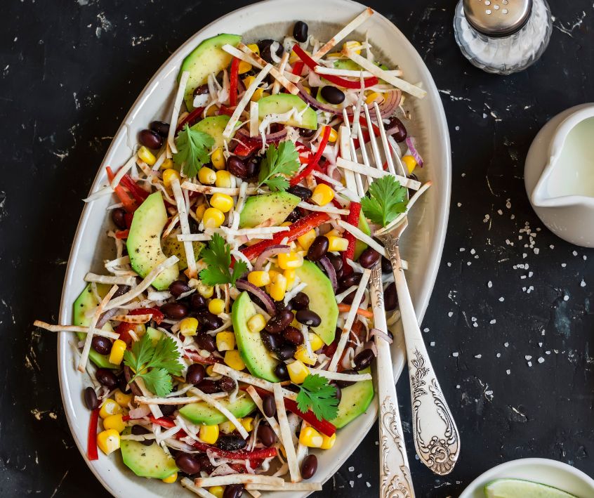 Salad with corn, beans, avocado and tortilla.